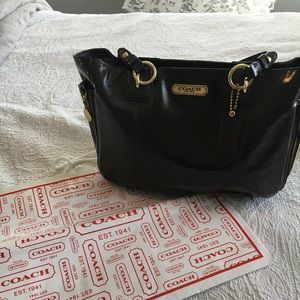 Brown leather coach purse.